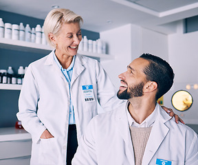 Image showing Research, medical and staff with conversation, laboratory and communication with a smile, science and collaboration. Teamwork, happy researcher and scientist in a lab, innovation and biotechnology