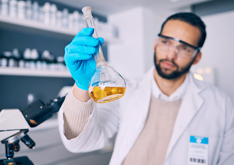 Image showing Science laboratory, chemical analysis and man check medicine progress, lab research or medical development. Chemistry process, beaker experiment and male scientist investigation of liquid solution