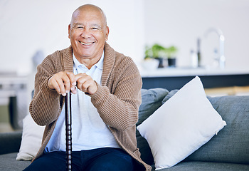 Image showing Portrait, home and old man with a smile, walking stick and relax with retirement, peace and calm on a couch. Senior person in a living room, elder or pensioner on a sofa, cane or support with health