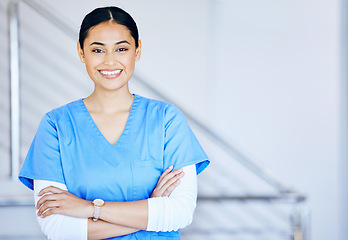 Image showing Portrait, nurse and woman with arms crossed, smile and career with healthcare, surgeon and expert in a hospital. Person, medical professional and physician in a clinic, wellness and life insurance