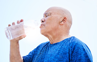 Image showing Senior man, drinking water and fitness outdoor, healthy body and h2o liquid for wellness nutrition. Elderly man, bottle and hydration after exercise, cardio workout or training in running sports.