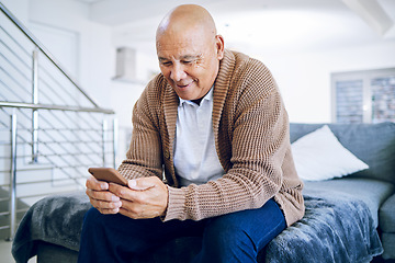 Image showing Old man on bed with phone, smile and typing message, communication and technology in retirement. Social media, internet and cellphone, happy senior person in bedroom reading email or chat online.