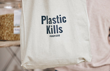 Image showing Eco friendly grocery store, recycling fabric shopping bag and commitment to climate change at sustainable small business. Zero waste, plastic kills logo and supermarket with carbon footprint choice.