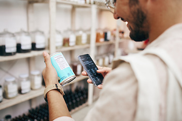 Image showing Customer, shopping and phone for reading grocery product, healthy food and can tin information in store. Research, happy man and nutritionist customer on technology for supermarket choice or decision