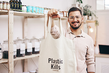 Image showing Man at eco friendly grocery store, recycling shopping bag and commitment to climate change at sustainable small business. Zero waste, plastic kills logo and supermarket with carbon footprint choice.