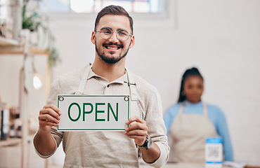 Image showing Open, sign and man with small business or restaurant happy for service in a coffee shop, cafe or store with a board. Smile, manager and portrait of an entrepreneur ready for operations with billboard