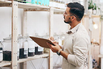 Image showing Grocery store, small business and man with checklist for inventory, healthy food and sales report. Clipboard, stock list and manager at sustainable supermarket with eco friendly groceries on shelf.