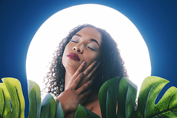 Image showing Beauty, lighting and face of woman with leaf for wellness, natural cosmetics and skincare in studio. Neon circle, creative aesthetic and person for makeup, glamour and facial care on blue background