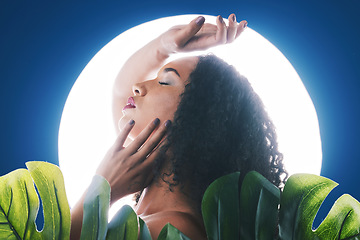 Image showing Skincare, neon and face of woman with leaf for wellness, natural cosmetics and beauty in studio. Circle light, salon aesthetic and profile of person for makeup, glamour and facial on blue background