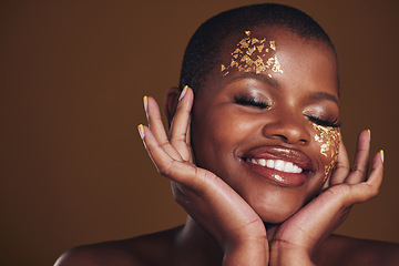 Image showing Gold beauty, makeup and woman face closeup with a smile from luxury treatment and facial spa mask. Glitter art, golden dermatology and African person with creative and sparkle cosmetics in studio