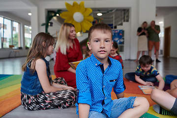 Image showing Portrait photo of a smiling boy in a preschool institution having fun