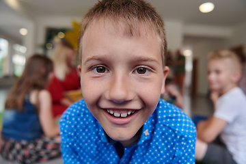 Image showing Portrait photo of a smiling boy in a preschool institution having fun