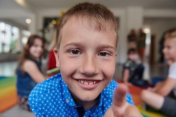 Image showing Portrait photo of a smiling boy in a preschool institution having fun