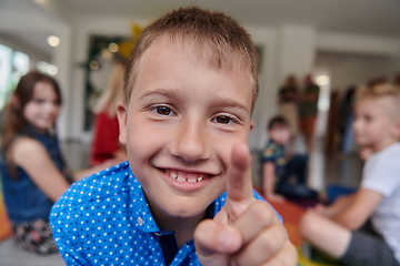 Image showing Portrait photo of a smiling boy in a preschool institution having fun