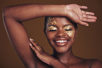 Image showing Gold, creative and art on black woman with makeup for beauty aesthetics isolated in studio brown background eyes closed. Smile, luxury and face of person with cosmetic glamour or design for skincare
