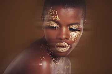 Image showing Gold beauty, luxury makeup and black woman with blur in studio with glitter cosmetics and sparkle art. Brown background, African female model and shine from paint and skin glow with golden treatment