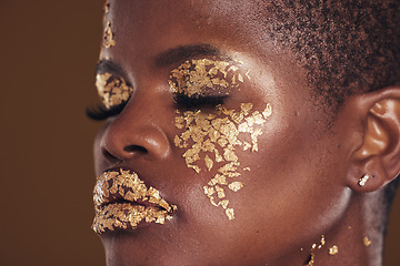 Image showing Gold, beauty and black woman with makeup for aesthetic isolated in a studio brown background eyes closed. Creative, luxury and face of African person with cosmetic glamour or design for skincare