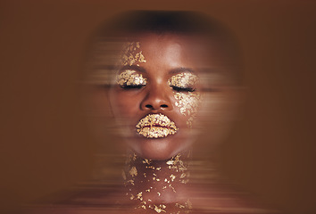 Image showing Blurred beauty, black woman with gold makeup and brown background, glitter paint or cosmetics. Shine, glow and art, face of African model in studio for fashion and aesthetic motion in luxury skincare