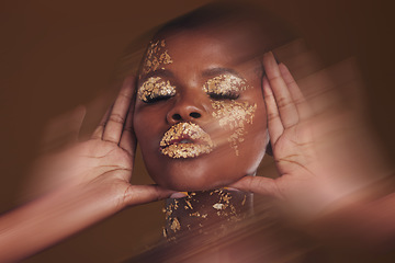 Image showing Gold beauty, makeup and black woman face with blur in studio with glitter cosmetics and sparkle art. Brown background, African female model and shine from paint and glow with golden luxury treatment