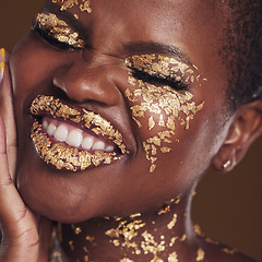 Image showing Black woman, face and gold makeup closeup with luxury dermatology and skincare mask with glitter. Sparkle, smile and beauty with rich and shine of cosmetics and model in a studio with facial art