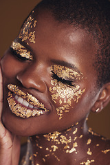 Image showing Black woman, face and gold cosmetics closeup with luxury dermatology and skincare mask with glitter. Sparkle, smile and beauty with rich and shine of makeup and model in a studio with facial art