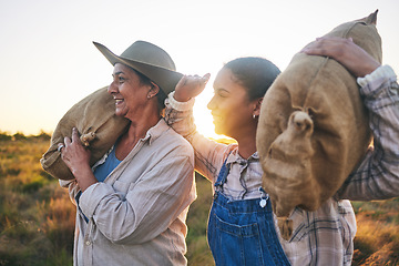 Image showing Farm harvest, women and countryside with a smile from working on a grass field with grain bag. Sustainability, eco friendly and agriculture outdoor at sunset in nature with farmer management mission