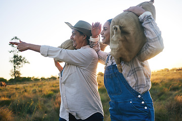 Image showing Farm harvest, women point and countryside with a smile from working on a grass field with grain bag. Sustainability, eco friendly and agriculture outdoor at sunset in nature with farmer growth view