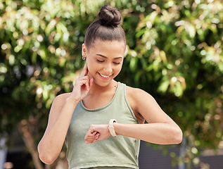 Image showing Smart watch, pulse and woman outdoor in fitness, exercise and workout in nature. Heart rate, clock and happy athlete check in cardio, training progress and sports in healthy body, wellness and time