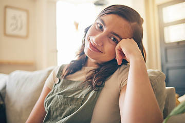 Image showing Happy, smile and portrait of woman on a sofa relaxing in the living room of her apartment. Calm, peaceful and face of young female person from Canada with positive attitude sitting in lounge at home.