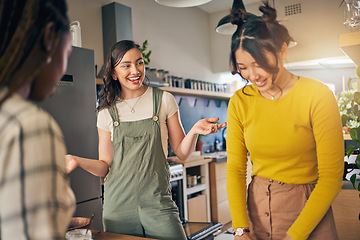 Image showing Conversation, bonding and girl friends in the kitchen of their new apartment having fun together. Happy, smile and group of young women talking and cooking a meal for lunch or dinner in a modern home