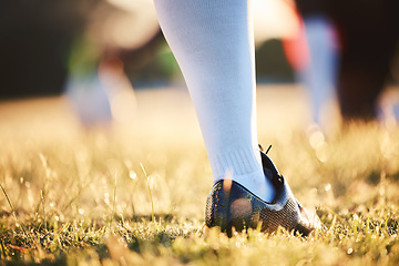 Image showing Sports, training and foot of person on field ready for game, competition and tournament outdoors. Fitness, mockup and closeup of shoes of player on grass for exercise, match and workout in practice