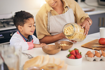 Image showing Breakfast, smile and food help with family and cooking with morning cereal at a home. Kitchen, love and happy support of a mother and young child with teaching and care for baking learning together