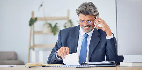 Image showing Business man, reading documents and phone call for contract negotiation, legal advice and compliance at desk. Corporate lawyer, smartphone and data analysis with paperwork, notes and smile in office