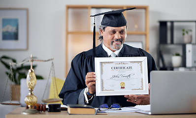 Image showing Laptop, video call and certificate with a man judge in his office, proud of an award as a law degree graduate. Computer, virtual and success with a mature legal student showing his prize to a webcam