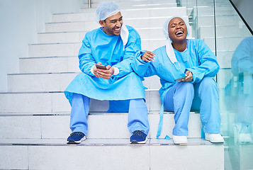 Image showing Surgeon, conversation and laughing on hospital stairs with phone and funny meme. Healthcare, medical and doctor team relax with comic and conversation together with mobile and social networking