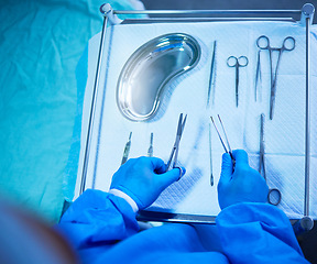 Image showing Surgery, nurse and table with tools in hospital, operation room and medical equipment with scalpel, scissors and bowl. Surgeon, hands and above doctor ready with medicine or tool for procedure