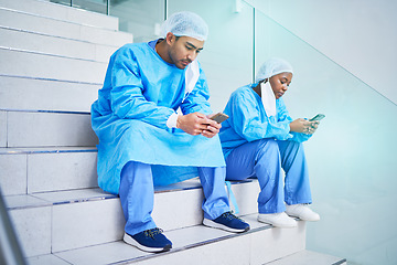 Image showing Surgeon team, stairs and phone in hospital for telehealth, healthcare or online wellness. Smartphone, doctor and people on steps on internet, reading email and medical professional research in clinic