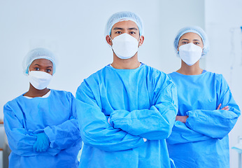 Image showing Face mask, surgeon team and people with arms crossed in hospital, healthcare and wellness. Portrait, doctor and medical professional group, expert nurse and confident surgery employee in ppe scrubs