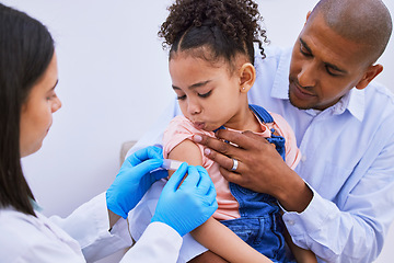 Image showing Doctor, father and child with plaster for vaccine, flu shot or medicine injection in clinic or hospital. Dad, girl with bandage and pediatrician in office for vaccination, consultation and healthcare