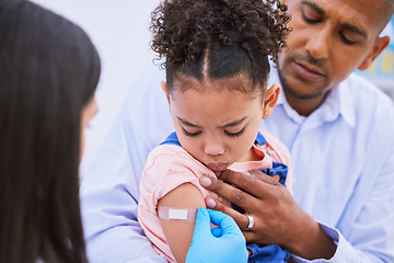 Image showing Pediatrician, dad and girl with plaster for vaccine, flu shot or medicine injection in clinic or hospital. Father, kid with bandage and doctor in office for vaccination, consultation and child care.