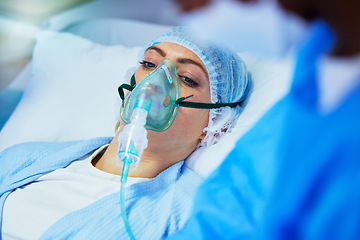 Image showing Hospital, anesthesia and woman with oxygen mask in surgery for medical service, operation and procedure. Healthcare, doctor and surgeons with gas, breathing and ventilation equipment for patient