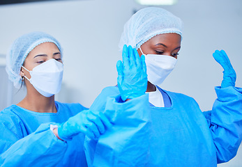 Image showing Doctor, theatre clothes and medical expert for surgery, operation, emergency and healthcare in hospital. Surgeon, women and professional nurse in teamwork and support for health, work and medicine