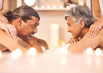 Image showing Mature couple, romantic massage at spa in candle light and wellness, relax and smile together. Holistic health therapy, zen and calm man with woman in profile on table in luxury salon in retirement.