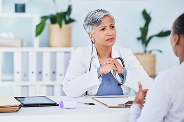 Image showing Doctor, serious woman and office in consultation, support and services, helping or medical advice. Nurse or senior expert listening to patient history or healthcare, consulting and clinic information
