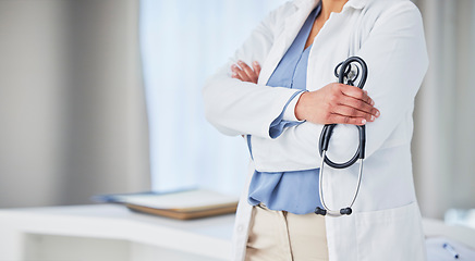 Image showing Healthcare, hands and woman doctor with arms crossed in hospital with stethoscope for medical examination. Health, checkup and female in a consulting room with lungs, heart or breathing analysis tool