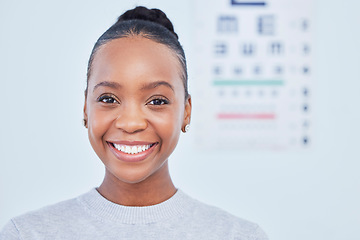 Image showing Face, black woman smile and ophthalmology patient in hospital for vision, healthcare or wellness. Portrait, optometrist and happy person in clinic with eye chart for medical professional optician