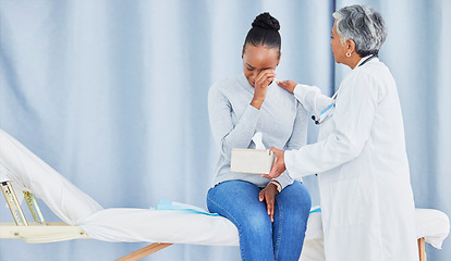 Image showing Doctor, patient and sad talk about hospital results of a black woman with tissue, support and cancer. Health care worker and sick person with bad news or conversation or crying with help and empathy