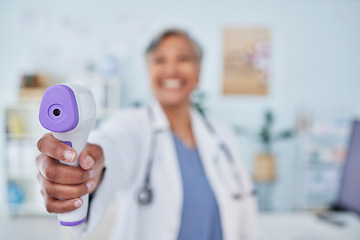 Image showing Happy woman, doctor and infrared thermometer in checking temperature or fever at hospital. Closeup of female person, medical or healthcare professional with laser scanner for flu screening at clinic