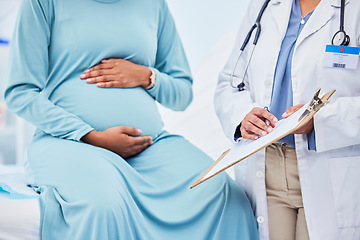 Image showing Doctor, woman hands and pregnancy in a hospital with mama, stomach and baby care. Wellness, abdomen and pregnant healthcare with nurse and medical chart of a clinic check for health of a mother