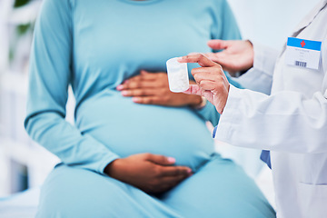 Image showing Doctor, pregnant patient and hands, pills in container and woman at hospital with gynecology. Supplements, healthcare and pregnancy, medical advice and fertility, help and trust from gynecologist